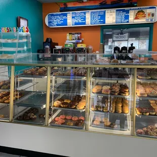 a display case filled with donuts