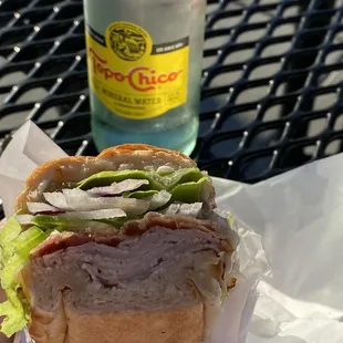 Turkey, Bacon, Pepper Jack Cheese, Green Pepper, Red Onion, Avocado, Mayo, Salt + Pepper on an Onion French Roll + a Sparkling Topo Chico