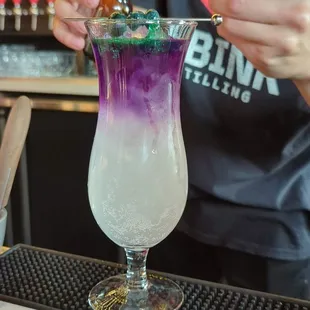 a purple and green drink