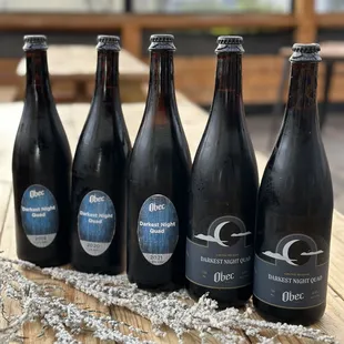 Quadsmas lineup in bottles! Darkest Night Quads 2019-2023.