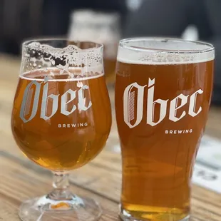 two glasses of beer on a table