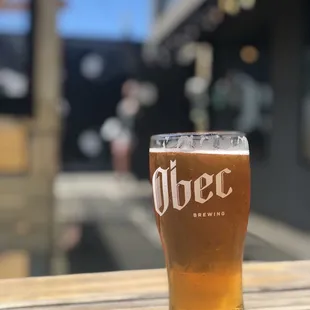 a glass of beer on a table