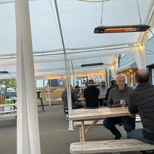 a man sitting at a picnic table