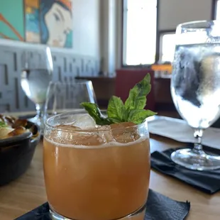 a drink in a glass on a table