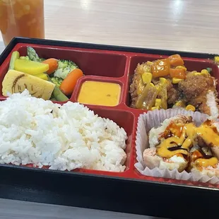 Curry Tonkatsu chicken with crab tempura,rice,steamed vegetables and yum yum sauce.