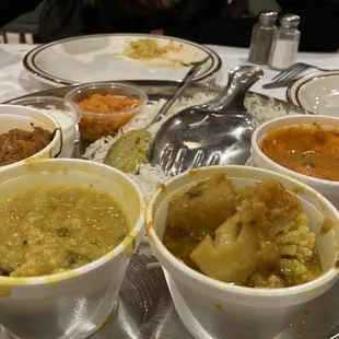 Veg thali (baigan bharta, daal, cauliflower/potato, paneer and carrot halwa in the back.