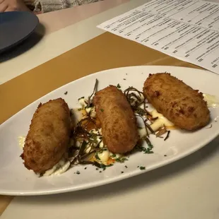 The Croquettes that were potato, mozzarella, and ham inside and had a very yummy sauce.