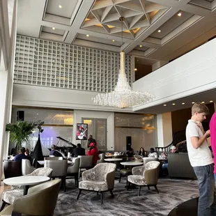 a man and a woman standing in a lobby