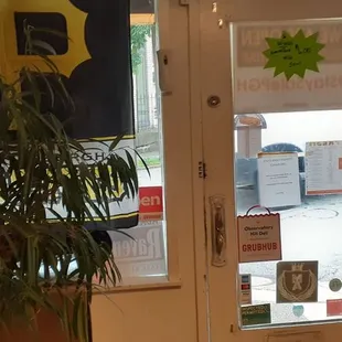 the front door of a deli shop