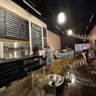 Bar top by the taps.