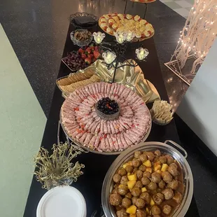 Hors d'oeuvres sweet-and-sour meatballs with tidbits of pineapple! Spiral rolled And on the end is  Deviled eggs!