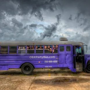 a group of people on a cloudy day