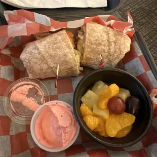 Seasoned shrimp wrap with dip.