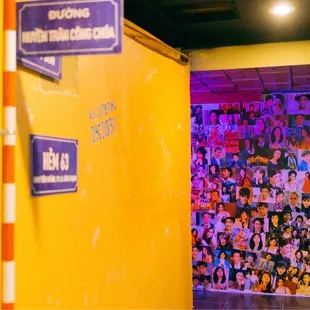 a bathroom with a yellow wall and a blue door