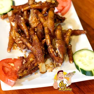 a plate of chicken wings and vegetables