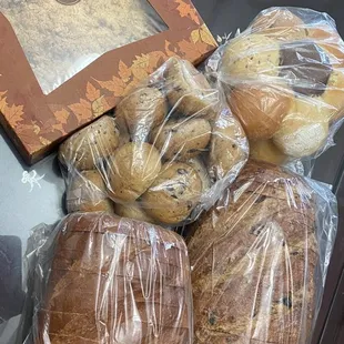 Clockwise: Crema apple crumble pie, sampler bread flower, cranberry walnut loaf, brioche loaf, black olive rolls