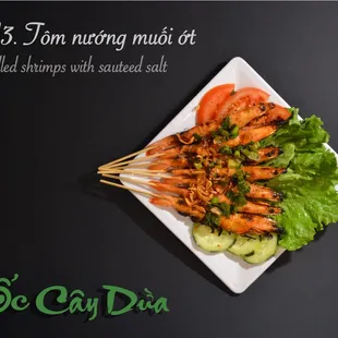 a plate of shrimp skewers