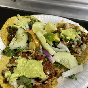 Al pastor tacos and carne asada taco