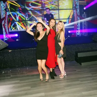 two women in red dresses posing for a picture