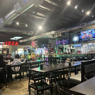 The eating area ,a small arcade area, and two pool tables to the rear.