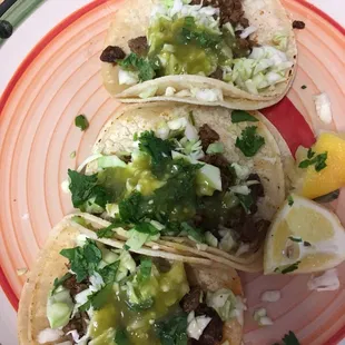 three tacos on a plate