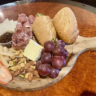 Deluxe Cheese Platter. It has 3 cheeses, 2 meats with fig jam, nuts, fruit &amp; bread. Great presentation &amp; very tasty.
