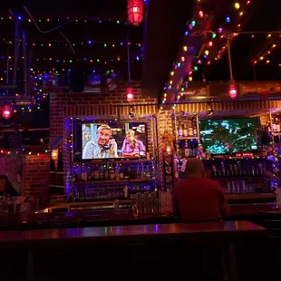 a bar decorated with christmas lights