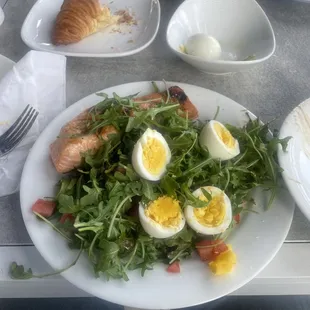 (I mixed this all on one plate) Grilled Organic Salmon with Arugula Salad and Hard Boiled Eggs