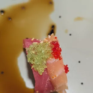a piece of sushi on a plate