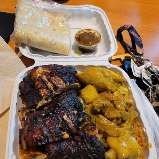 2 chicken meal - jerk chicken, curry chicken, jollof rice and rotti