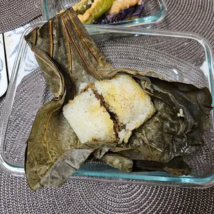 a glass dish of food on a table