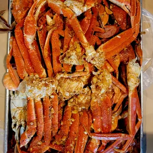 a tray of cooked crab legs