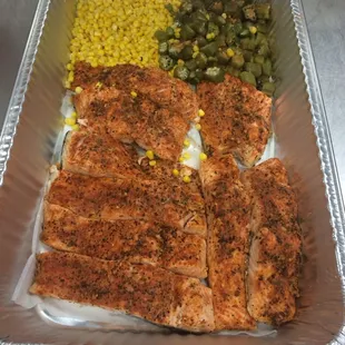 salmon, corn, and green beans in a foil pan