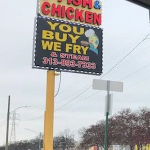a sign for a fish and chicken restaurant