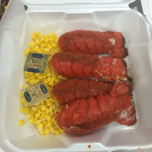 lobster and corn in a styrofoam container