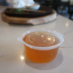 Handy takeout container for leftover fish sauce.