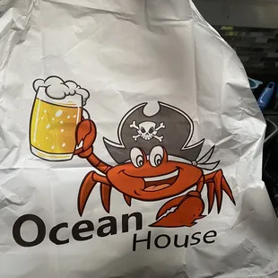 a crab holding a mug of beer