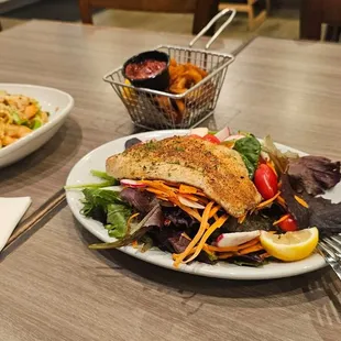Garlic shrimp noodles, blacken Catfish salad and a side of calamari.