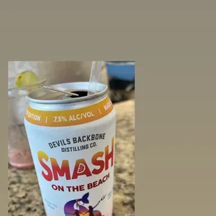 a can of smash on the beach