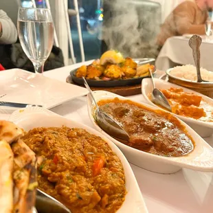 Coconut Vegetable Curry, Lamb Curry, Chicken Tikka Masala, and Chicken Tandoori Chicken Special