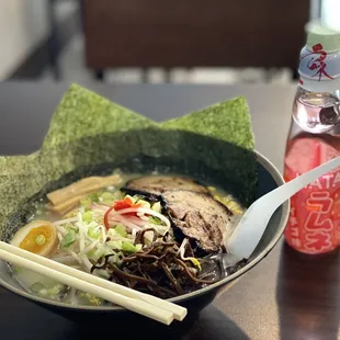 a bowl of ramen and chopsticks