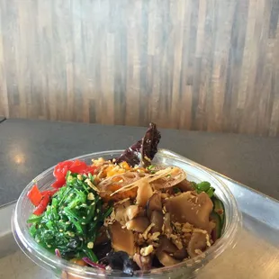 a bowl of food on a tray