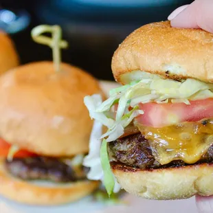 The Prime Cheeseburger Sliders were made with OP Sauce, Caramelized Onions, Tillamook Cheddar, Lettuce, &amp; Tomato.