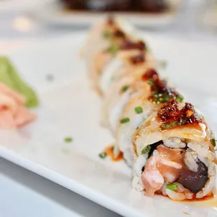 The Ocean Roll is made with #1 Tuna, Salmon, Hamachi, Avocado, Chili Garlic Oil (only $13.50 during Happy Hour).