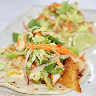 The Blackened Fish Taco is made with Sea Bass, Brussels Sprout Slaw, Jalapeńo Tartar Sauce, &amp; Lime (only $10.50 during Happy Hour).