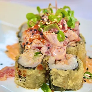 The Spicy Tuna Roll is made with Cucumber, Scallion, and is Tempura Fried (only $12.50 during Happy Hour).