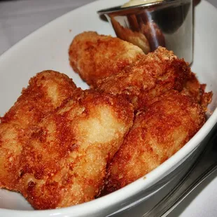 The tots were crisp potato pillows of cheesy goodness. The interior was hot &amp; fluffy with potato and creamy cheese.