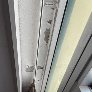 Chipping paint over the balcony door.