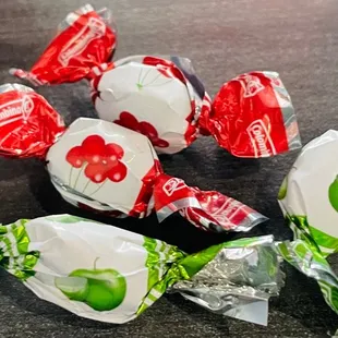 a group of candy wrapped in wrappers