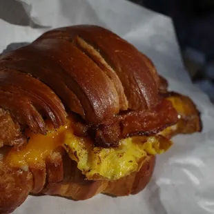 Croissant with egg cheese, bacon, and béchamel sauce so delicious